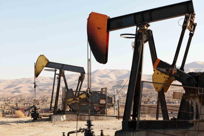 Oil pumps and refinery in oil field