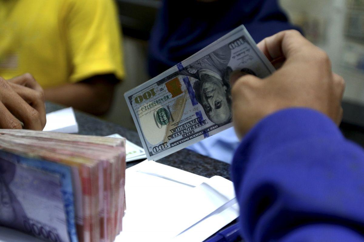 Ilustrasi nilai tukar rupiah, kurs rupiah dan dollar AS.